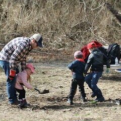 Family volunteers homesite clean up day