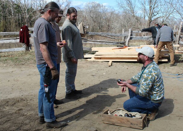 Volunteers staff talking village clean up day
