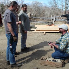 Volunteers staff talking village clean up day