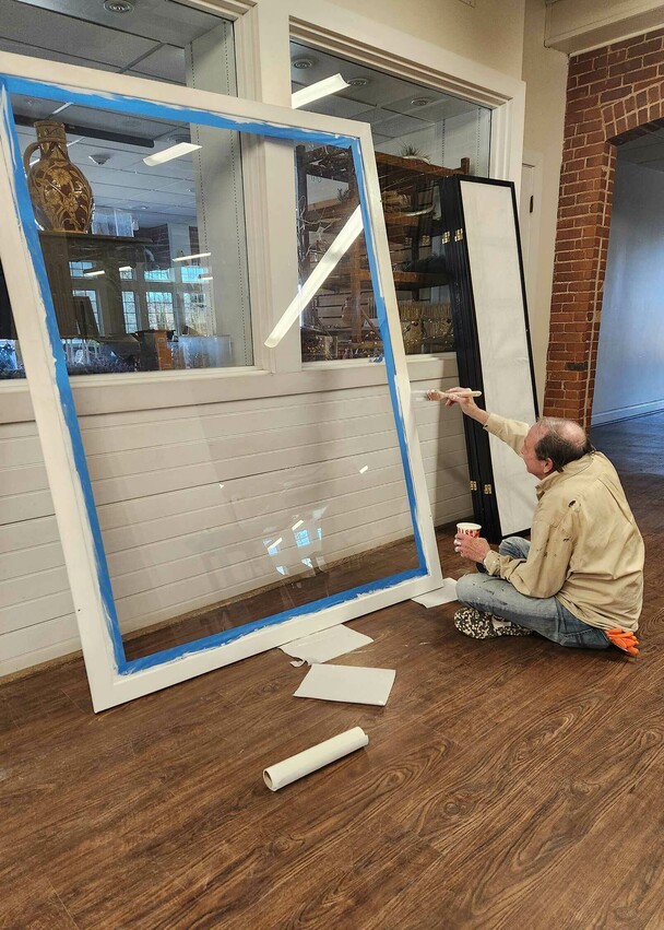 Volunteer trustee painting clean up day