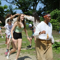 Guests and Educators take part in a traditional Wampanoag dance on the Homesite.