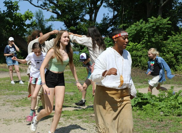 Guests and Educators take part in a traditional Wampanoag dance on the Homesite.