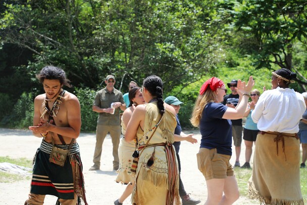 Educators demonstrate a traditional Wampanoag dance in front of guests at the Homesite on Strawberry Thanksgiving