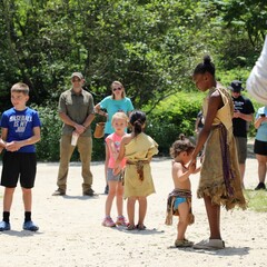 Children participate in Wampanoag dance on the Historic Patuxet Homesite