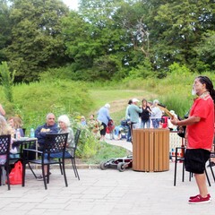 Summer music series the groovalottos center pavilion guitar player