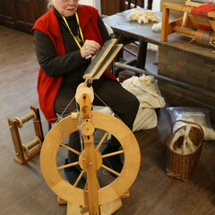 A textile artisan demonstrates her craft.
