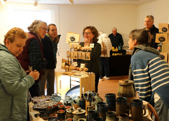 Guests at the Winter Fine Arts & Craft Fair shop handmade pottery.